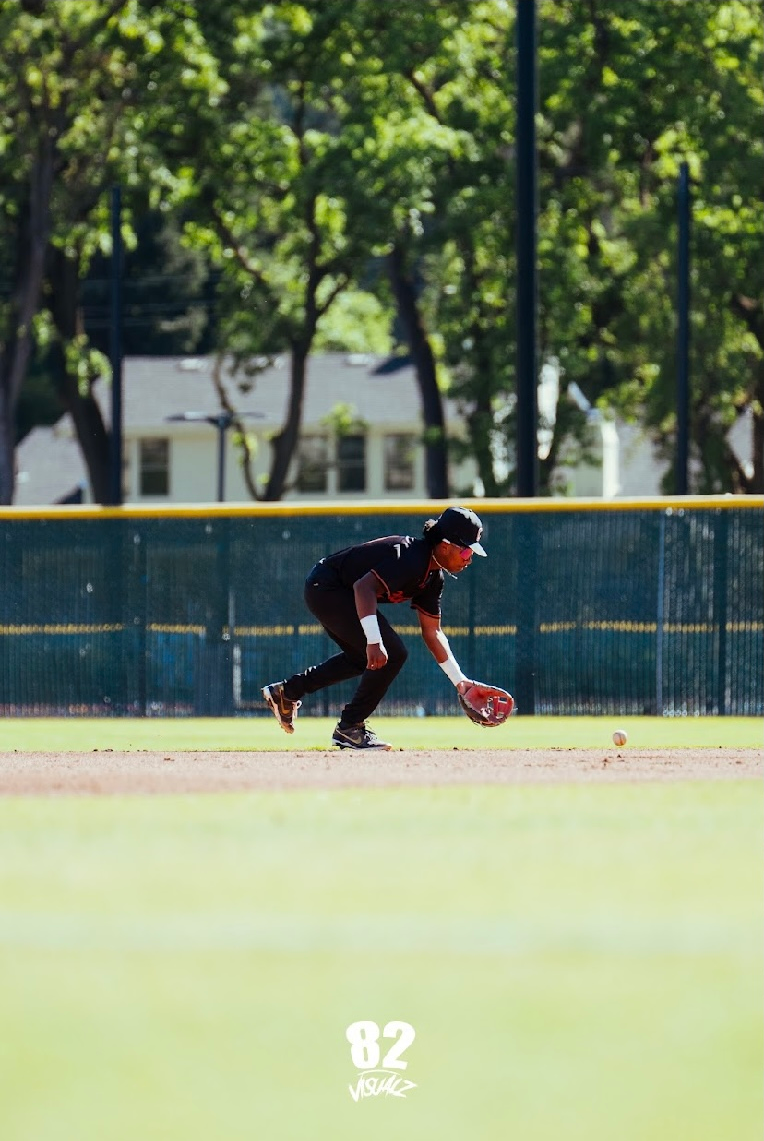 Kai Watts fielding a ground ball at shortstop