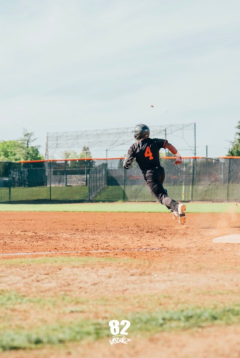 Kai Watts, #4, running the bases at full speed